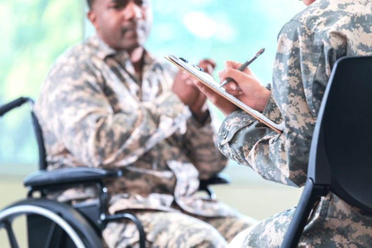 Veteran in a wheelchair being interviewed.