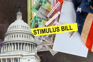 Federal reserve building. American flag. Notepad. US dollar bills. Text stating "STIMULUS BILL."